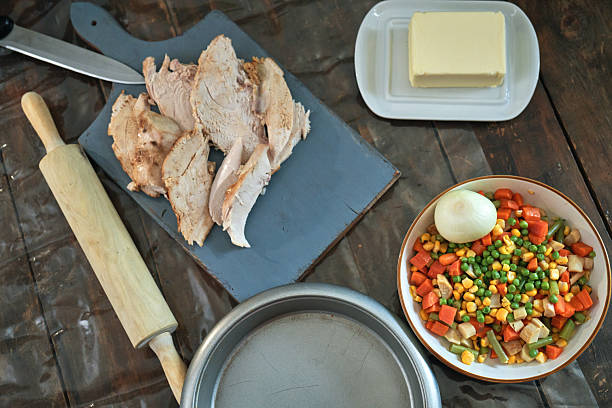Preparing Thanksgiving Leftover Pie with Turkey, Vegetables and Boiled Eggs