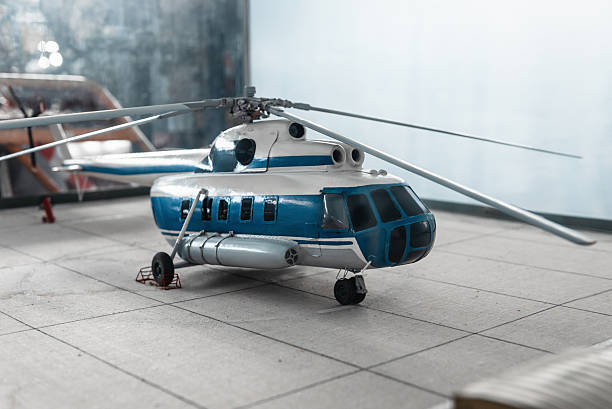 A Bell-Boeing CV-22 Osprey tilt-rotor military aircraft, as used by the US military, seen here in an arid desert environment. Scale model photography.