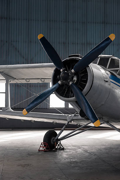 istock Close-up view of propeller biplane in a hangar. 2246716668