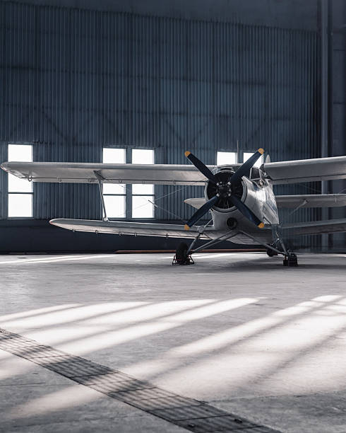 istock Front view of an old propeller aircraft in a hangar. 2246716721
