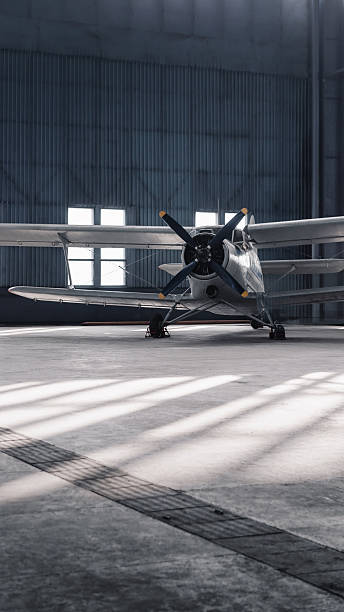 istock Front view of an old propeller aircraft in a hangar. 2246716734