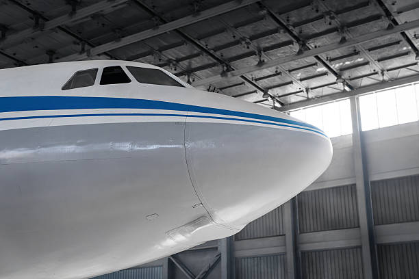 istock Front part of passenger aircraft in a hangar. 2246716777