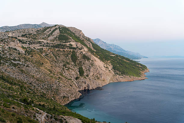 istock Rocky Adriatic coastline with mountain slopes 2246717803