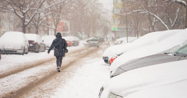 istock City streets blanketed in snow during a serene winter snowfall 2246718261