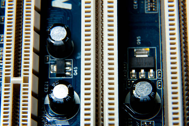 Close-up of an assembled electronic printed circuit board with slots and connectors