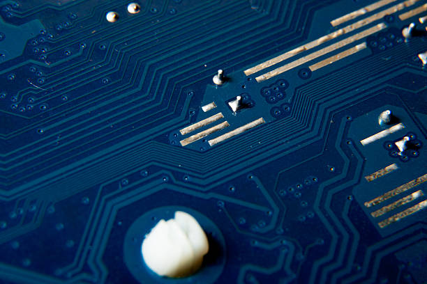 Close up of a backlit computer motherboard. Symmetrical composite.