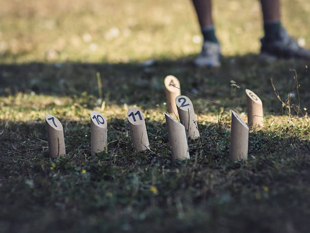 Group of kids in circle playing fun games during playtime at outdoor school playground