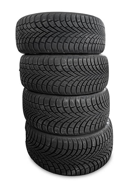 istock Winter car tires stacked on white 2246723743