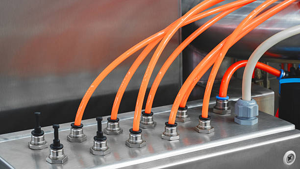 istock Close-up of precise industrial equipment with pneumatic components:  plastic tubes with connectors. Industrial concept background. 2246729806