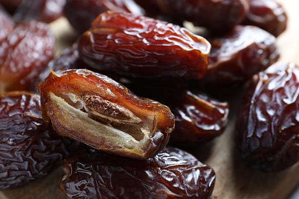 istock Many tasty dried dates on table, closeup 2246730638