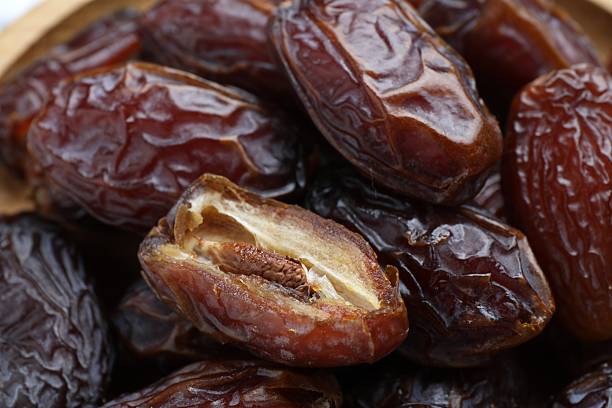 istock Many tasty dried dates as background, closeup 2246730640