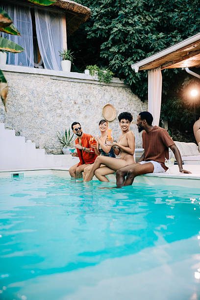 istock Friends Having Fun by the Pool with Cocktails 2246731651