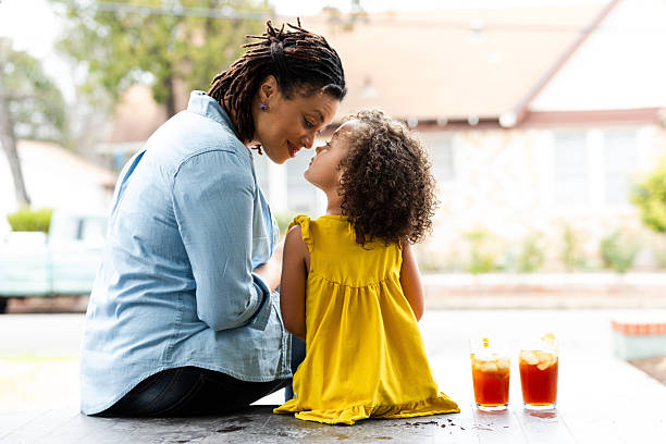 istock Mother and daughter sharing a tender moment outdoors on a warm day. 2246731782