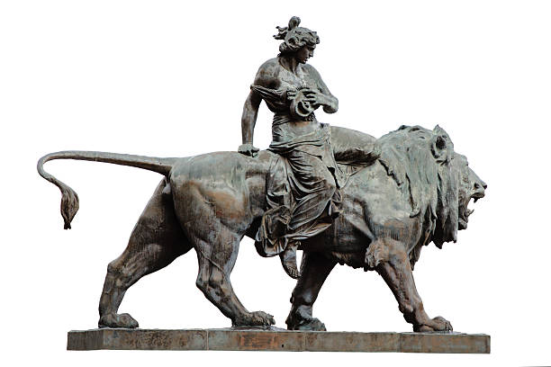 white cut out of a dramatic bronze sculpture of a muscular female rider on a powerful lion, conveying motion, strength, and mythic presence.