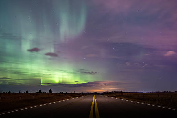istock Northern Lights overlooking rural road 2246734860
