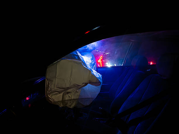 istock Car airbag deploying after an accident at night 2246737766