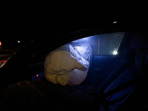 istock Deployed airbag inside car after vehicle accident at night 2246737767