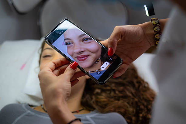 istock Woman recording eyelash extensions before and after on phone 2246737957