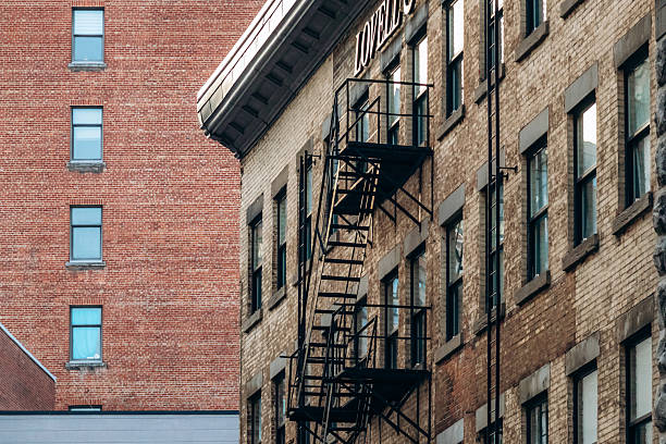 istock Fire escape staircase on a historic brick building in downtown Montreal, Quebec 2246737977