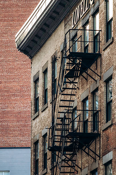 istock Fire escape staircase on a historic brick building in downtown Montreal, Quebec 2246737981