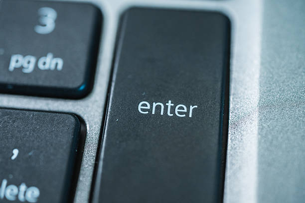 istock Macro photography of enter key on numeric keypad with metallic frame and texture.. 2246739104