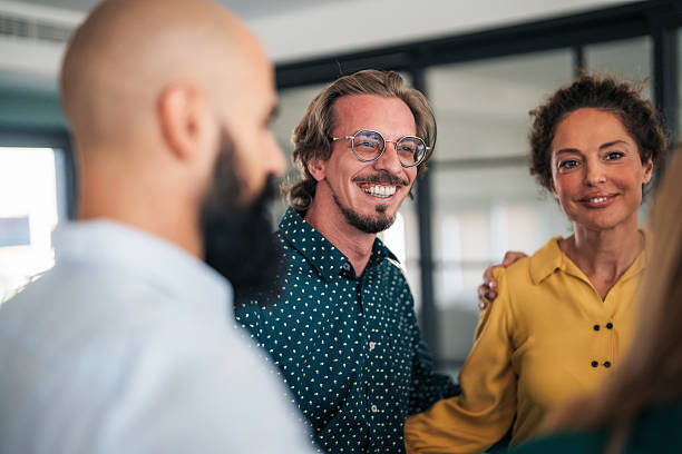 istock Business team embracing after achieving goals 2246741472