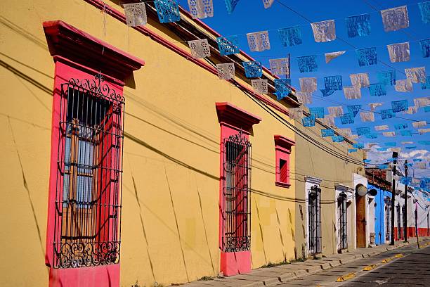istock Yellow Facade with Papel Picado Overhead (Oaxaca de Juarez, Mexico) 2246745354