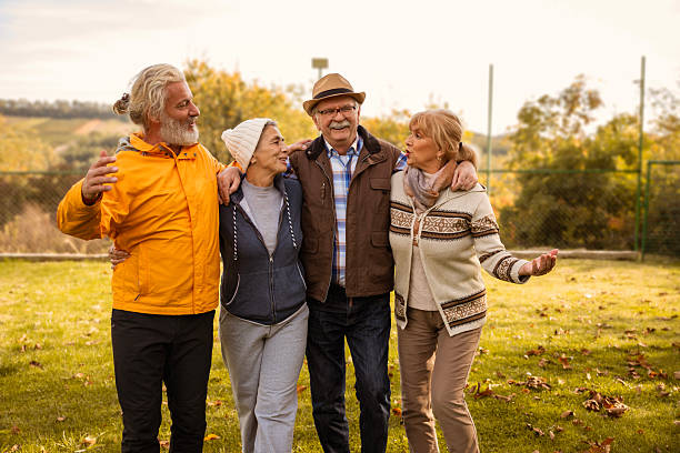 istock Group of happy active seniors in the park 2246745379