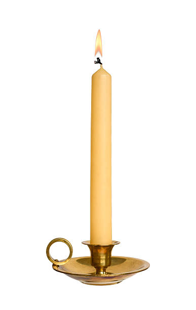 istock Brass candle holder with burning taper candle isolated cutout 2246746317