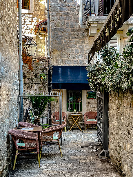 istock relaxing quaint courtyard environment, serene stonepaved courtyard featuring cafe furniture and lush 2246749177
