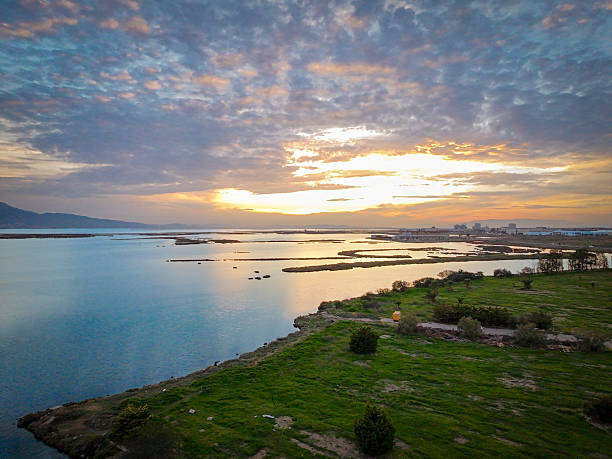 Breathtaking view of a sunset reflecting on tranquil waters.
