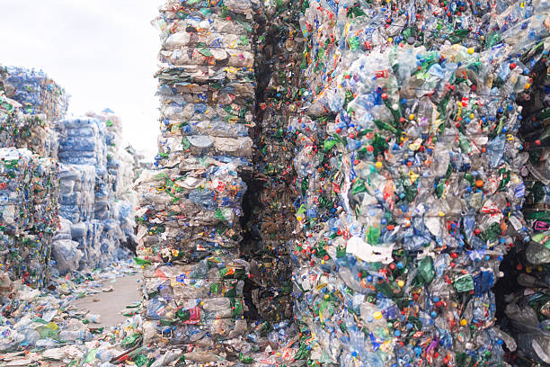istock Massive bales of used plastic bottles pressed together for recycling 2246755608