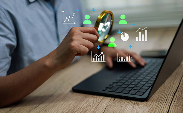 istock Business analytics concept showing a person using laptop with magnifying glass and digital charts, symbolizing data analysis, marketing procurement insights, performance optimization 2246769373