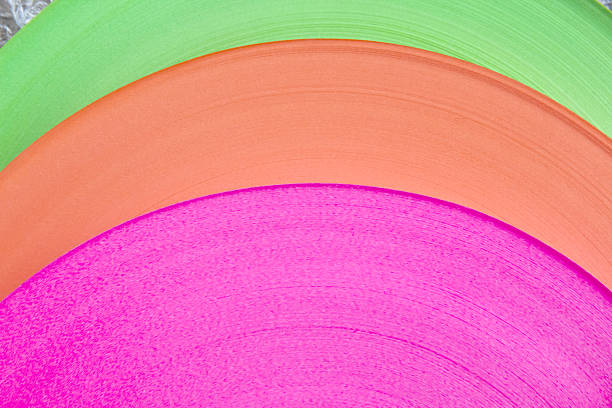 Ribbon roll texture pink orange green colorful on background
