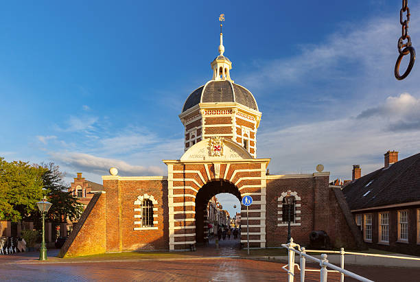 Morspoort city gate in Leiden Netherlands with dome and archway in sunlight
