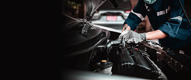 istock Car care maintenance and servicing, Close-up hand technician auto mechanic using the wrench to repairing change spare part car engine problem and car insurance service support. 2246778532