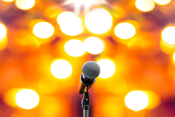 Microphones Public speaking background, Close up microphone on stand for speaker speech presentation stage performance or press conference backgrounds.