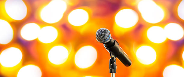 istock Microphones Public speaking background, Close up microphone on stand for speaker speech presentation stage performance or press conference backgrounds. 2246778940