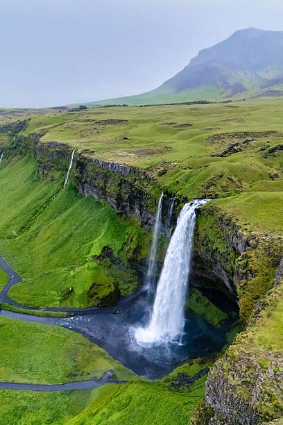 istock Majestic Seljalandsfoss Waterfall cascading down lush green cliffs in Icelands serene landscape 2246779866