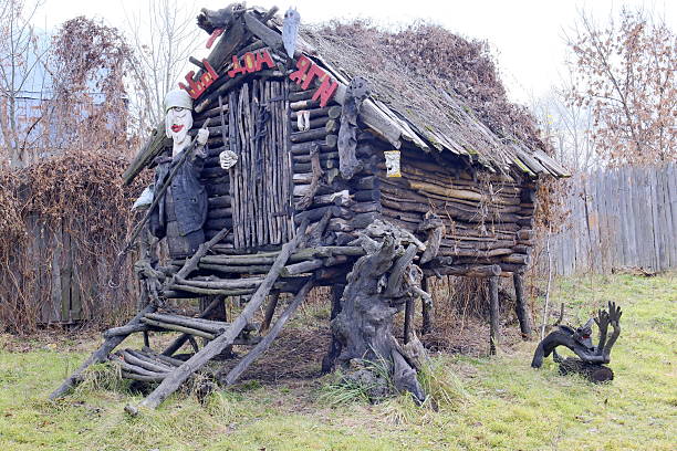 Russia, Ertil, October 24, 2025. Fairytale character. Baba Yaga on the threshold of her hut. Ethnographic Museum.