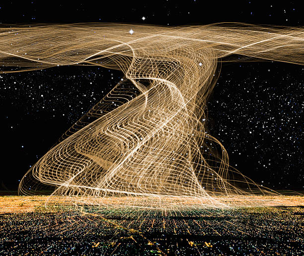 Conceptual image of digital light trail over city skyline at night