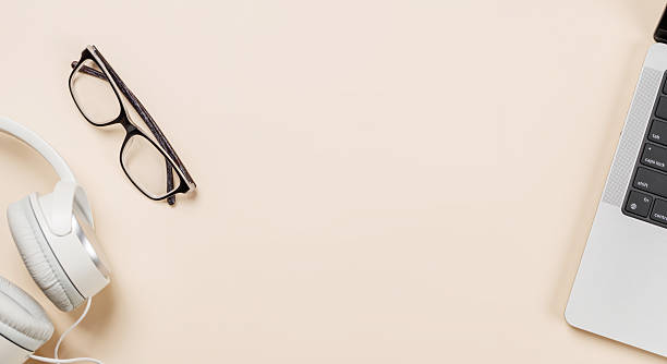 istock Laptop and stationery on beige workspace, top view with copy space 2246786018