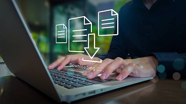 istock Laptop File Download Interface with Digital Overlay 2246787039