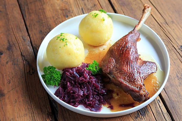 istock Duck leg with red cabbage and dumplings 2246789653