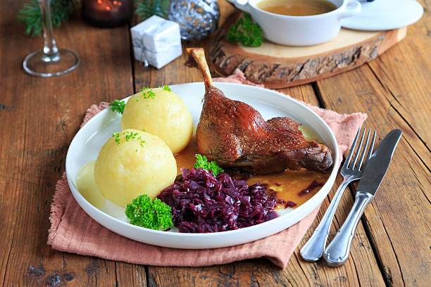 istock Duck leg with red cabbage and dumplings 2246789655