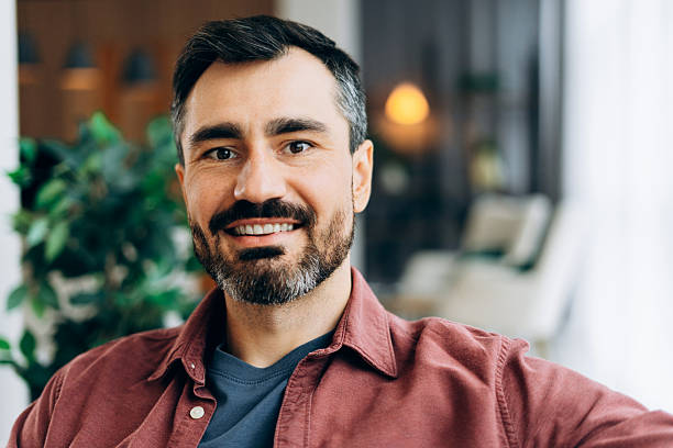 istock Mid adult man smiling confidently inside 2246789723