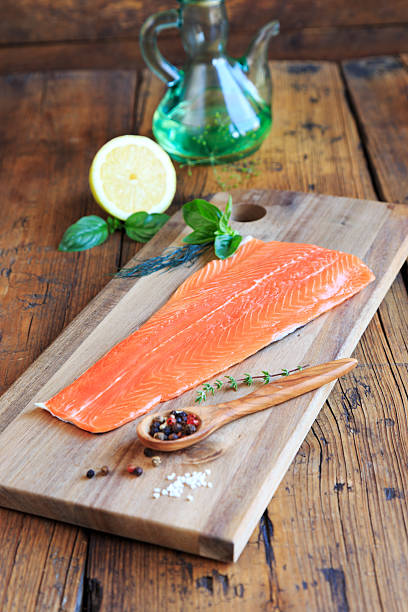 Fresh salmon fillet on a wooden cutting board