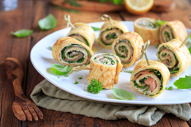 istock Homemade salmon rolls on a white plate 2246790625