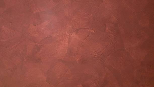 istock Dark red and black background, painted concrete wall texture, rough uneven plaster. 2246791422