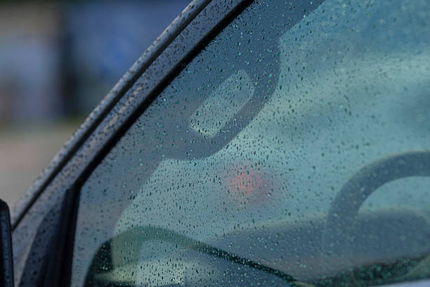 istock Contemplative moment inside moving vehicle as rain blurs horizon 2246792842